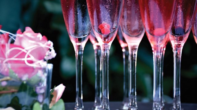 Pink cocktails in champagne flutes