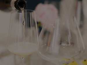 Pouring sparkling wine into glasses