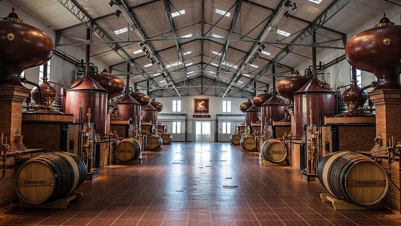 Inside distillery with copper tanks.
