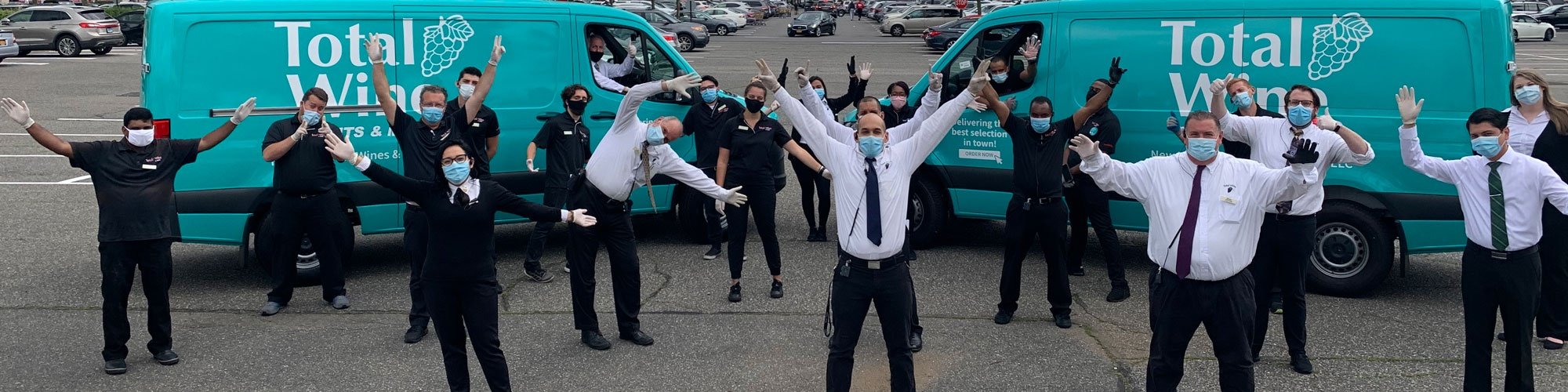 Photo of Total Wine & More team in Jacksonville, Florida next to delivery vans. Now offering alcohol delivery to Fernandina Beach, St. Augustine, Amelia Island, and Palm Coast!