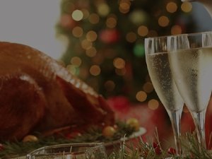 Holiday foods with two glasses of sparkling wine