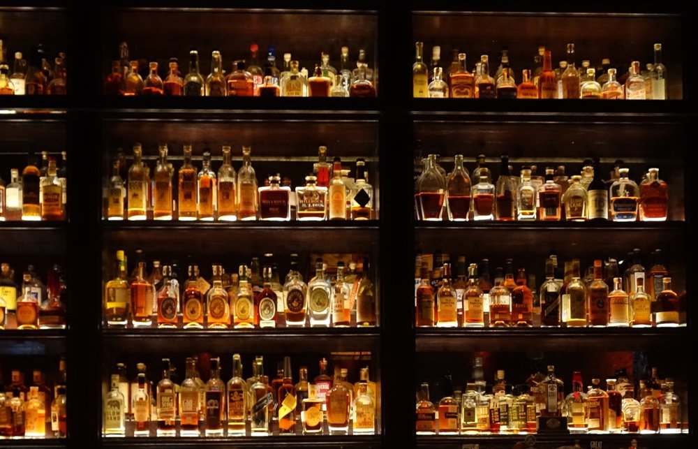 Bar fully stocked with Whiskey shelves