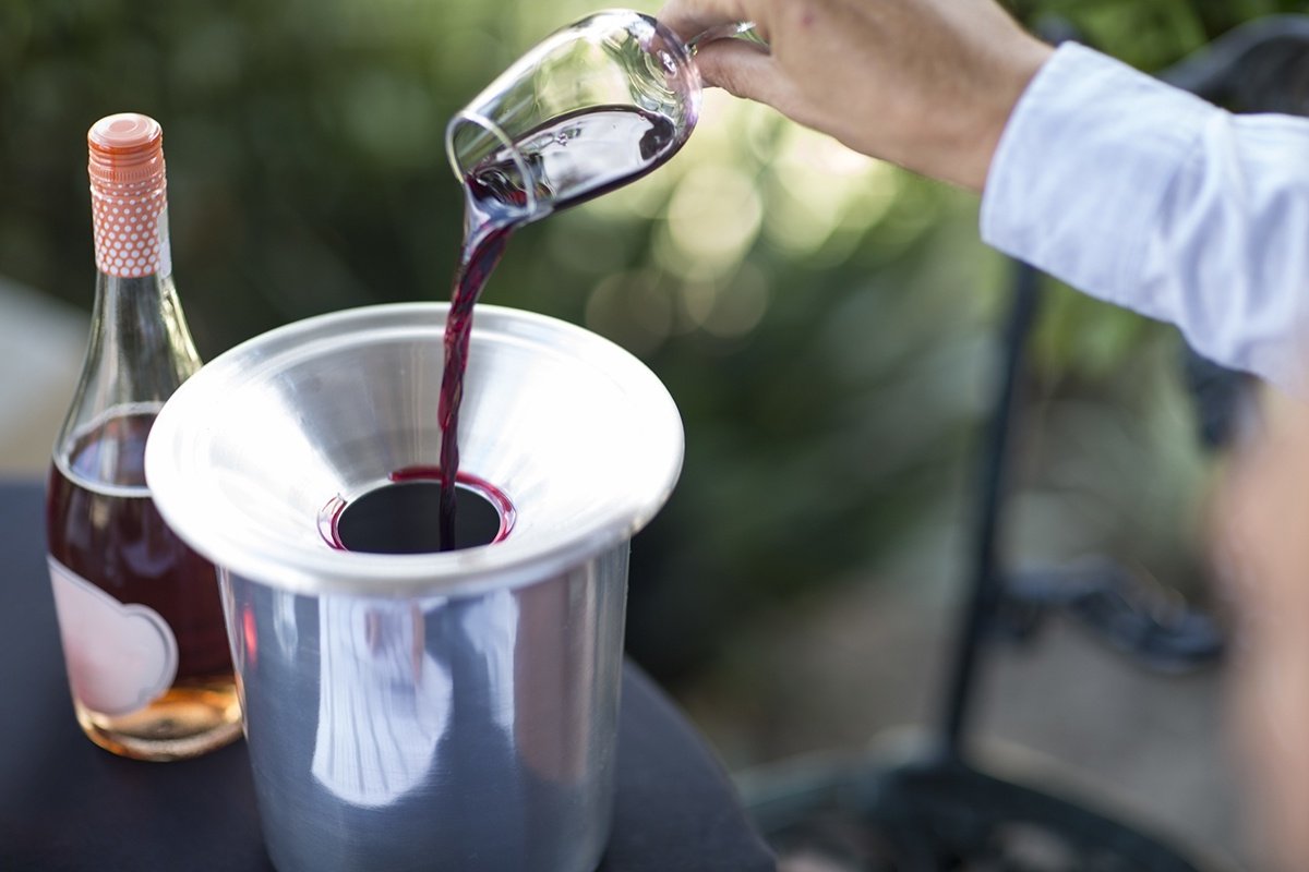 Disposing wine into a spit bucket