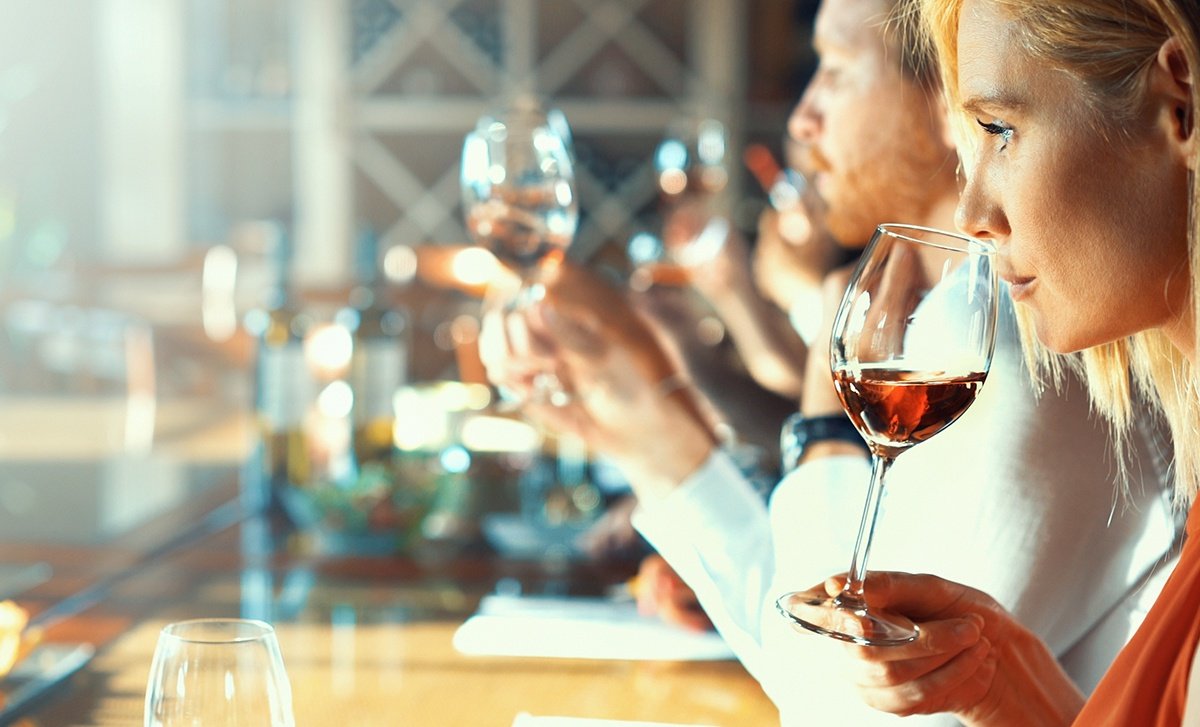 Wine taster sniffing the aroma of a wine glass