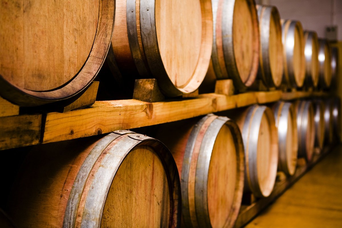 Barrel room containing barrels of California wines