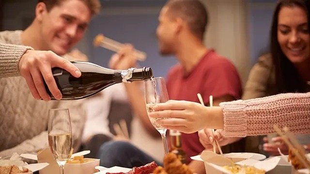 chinese food takeout, white sparkling wine, chopsticks, friends.